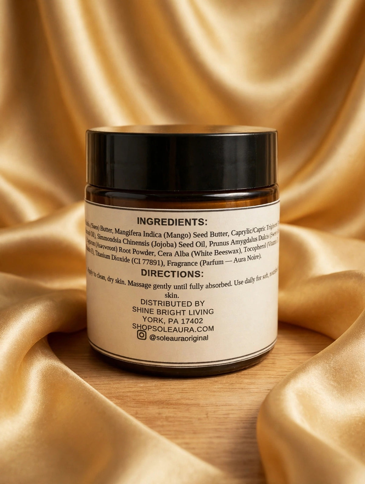 Solé Aura Whipped Body Butter — Aura Noire, back label with ingredients and directions, gold silk background